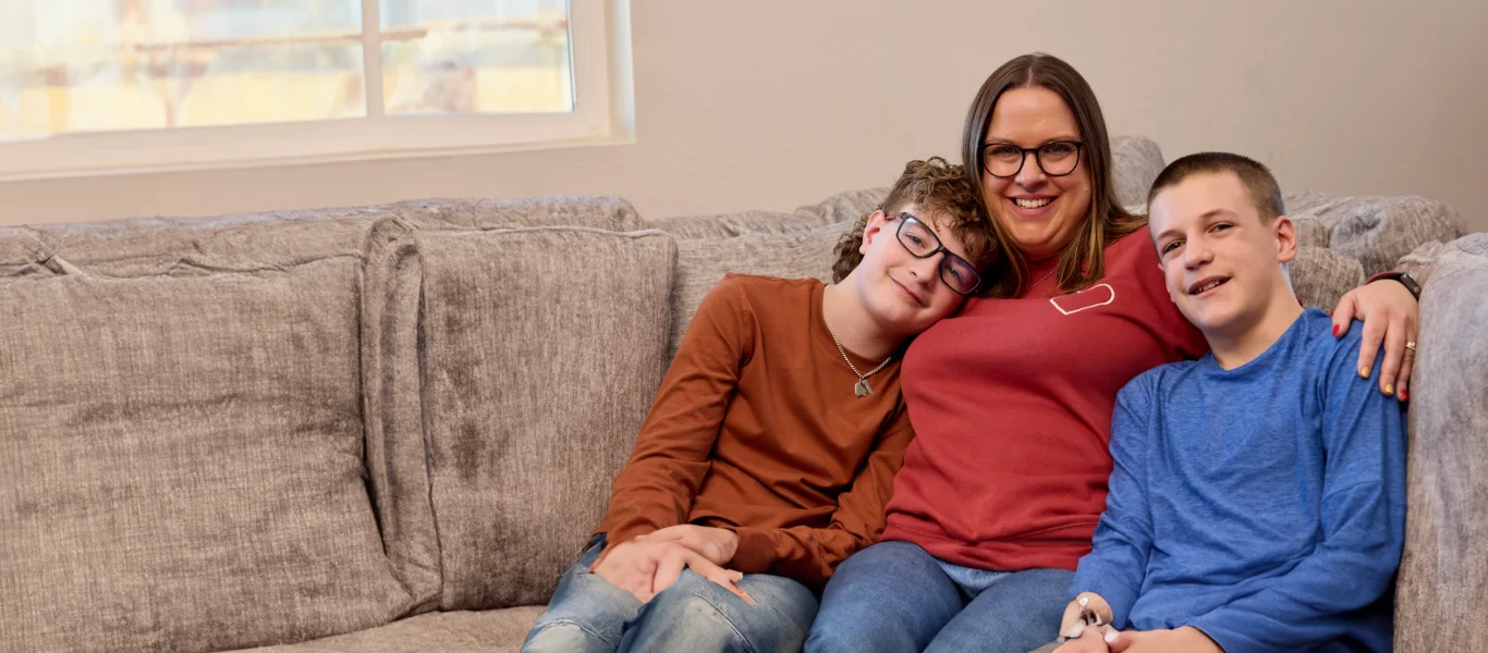 Mother with her sons at their home