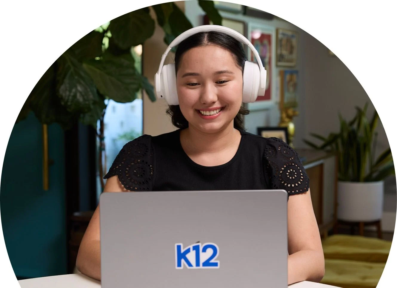Student wearing a white pair of headphones